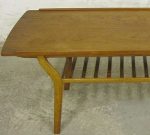 Danish 50's teak coffee table with magazine shelf