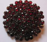 Silver brooch with garnets